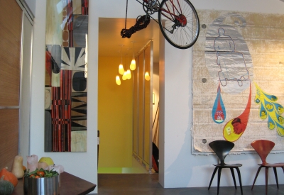 Living space with bikes hanging from the ceiling at Shotwell Design Lab in San Francisco.