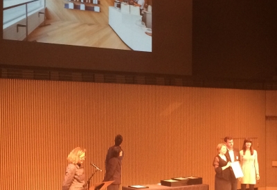 Ian Dunn of OpenScope Studio and Amanda Loper of David Baker Architects accept the AIA SF Design Award for Interior Architecture for Saint Frank Coffee in San Francisco.