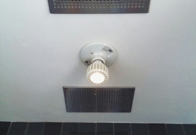 Air exhaust and LED light fixture in the bathroom at Zero Cottage in San Francisco.