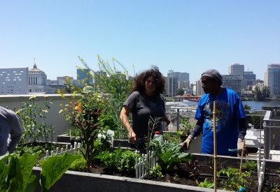 Residents at the rooftop garden in Lakeside Senior Housing in Oakland, Ca