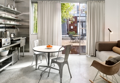 Interior view of the dining and kitchen area at Shotwell Garden Retreat in San Francisco.