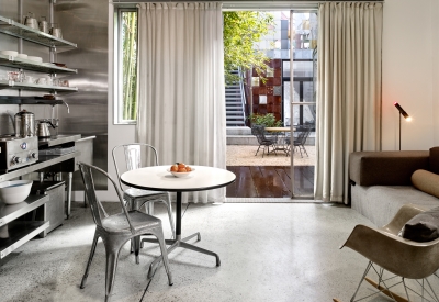 Interior view of the dining and kitchen area at Shotwell Garden Retreat in San Francisco.