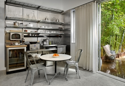 Small kitchen and dining table inside Shotwell Garden Retreat in San Francisco.