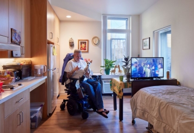 Resident inside his unit in Tahanan Supportive Housing in San Francisco