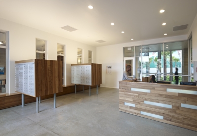 Entry lobby with custom mailboxes and reception desk at Richardson Apartments in San Francisco.
