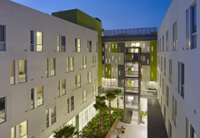 Night view of illuminated courtyard at Richardson Apartments in San Francisco.