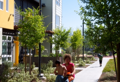 Kids riding a bike at Tassafaronga Village in East Oakland, CA. 