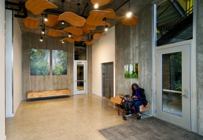 Custom sculpture and bench by DBA Workshop inside Coliseum Place, affordable housing in Oakland, Ca