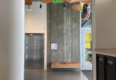 Custom sculpture and bench by DBA Workshop inside Coliseum Place, affordable housing in Oakland, Ca