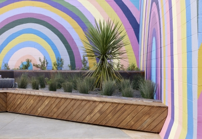 Rainbow mural in the courtyard at Tahanan Supportive Housing in San Francisco.