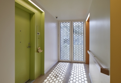 Residential hallway inside Tahanan Supportive Housing in San Francisco.