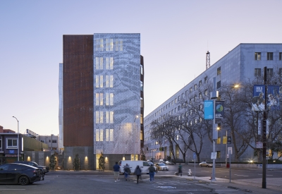 Exterior at dusk of Tahanan Supportive Housing in San Francisco.