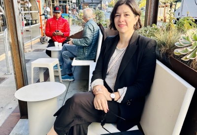 DBA Principal, Amanda Loper sitting at the Saint Frank Parklet in San Francisco.