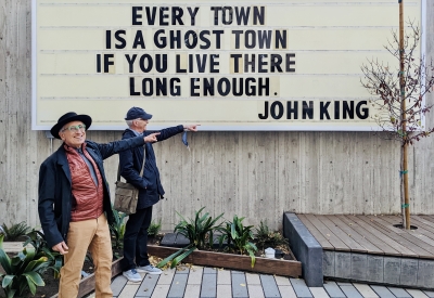 Refurbished sign at the previous site, now sits in the courtyard at 555 Larkin in San Francisco which states "Every town is a ghost town if you live there long enough. - John King"