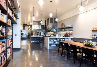 Custom adjustable height table and bookshelf at Civic Kitchen in San Francisco.