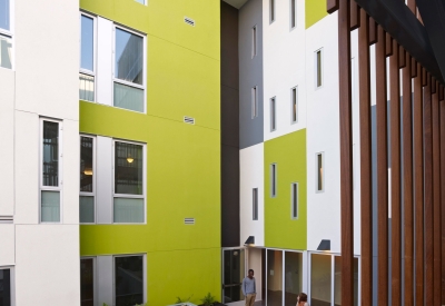 View from the open-air stairs of second-level outdoor community space at Richardson Apartments in San Francisco.