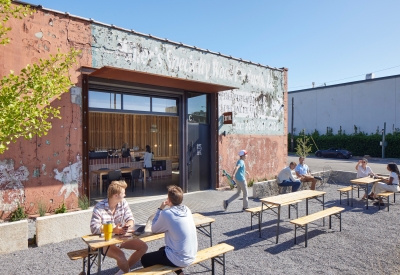 View of multiple people enjoying the open courtyard at the Bandsaw Building in Birmingham, Alabama.
