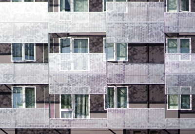 Exterior detail view of the façade at Coliseum Place in Oakland, California.