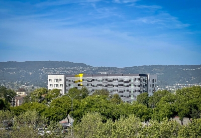 Exterior view of Coliseum Place from a distance in Oakland, California.
