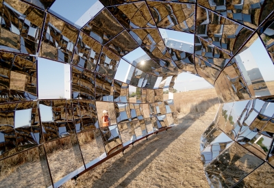 Looking through peepSHOW in the desert with mountains behind it in New Cuyama, California.