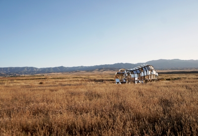 peepSHOW in the desert with mountains behind it in New Cuyama, California.