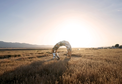 Looking through peepSHOW in the desert with mountains behind it during dusk in New Cuyama, California.