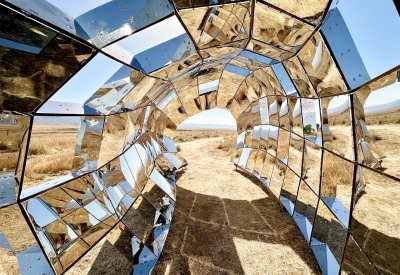 Looking through peepSHOW in the desert with mountains behind it in New Cuyama, California.