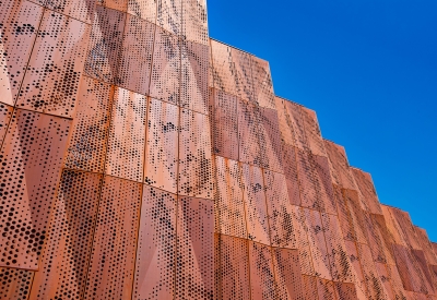 Detail view of the weathering cor-ten facade on the exterior of Blue Oak Landing in Vallejo, California.