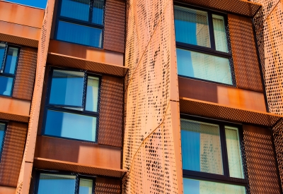 Detail view of the weathering cor-ten facade sunshades on the exterior of Blue Oak Landing in Vallejo, California.