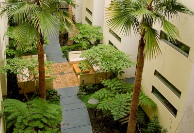 View of courtyard with conversation pit from above at Pacific Cannery Lofts in Oakland, California.