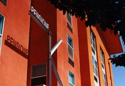 Metal K sign with the Pensione K in the background.