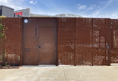 Cor-ten steel fence enclosing the courtyard at David Baker Architects Office in Oakland, California.