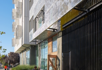 Exterior view of the front entrance to Coliseum Place in Oakland, California.