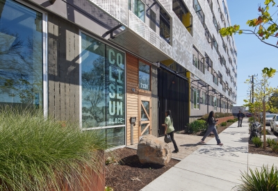 Exterior view of the front entrance to Coliseum Place in Oakland, California.