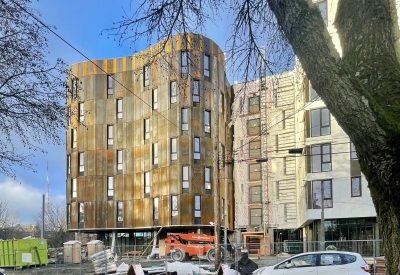 Construction of the cor-ten facade at Africatown Plaza in Seattle, Washington.