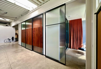 DBA_OAK sliding doors separating the conference room and storefront.