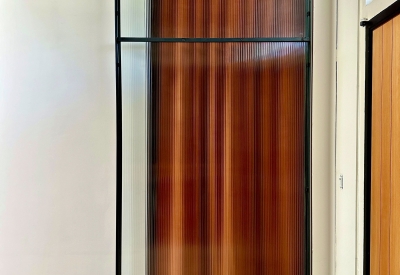 DBA_OAK sliding doors separating the storefront lounge.
