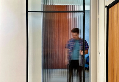DBA_OAK sliding doors separating the storefront lounge.