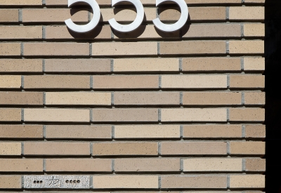 Exterior view of the tiles and adress—555 on the building.