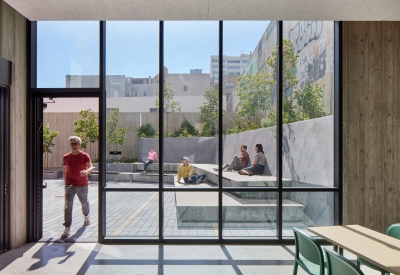 Floor to ceiling windows in the lounge looking out to the courtyard at 555 Larkin in San Francsico.