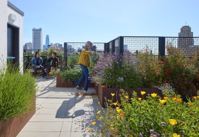 Residents gardening on the rooftop garden at Interior view of a unit at 555 Larkin in San Francisco.