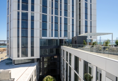 Exterior view on the seventh floor roof deck looking into the courtyard at Isle House on Treasure Island.