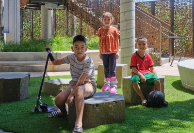 Children playing in the entry courtyard of Sango Court.