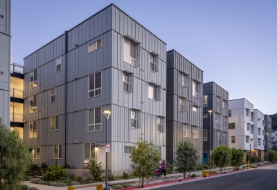 Exterior street view at dusk of 88 Park Street at Midway Village.