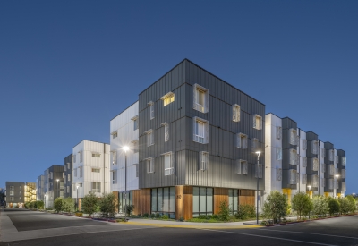 Exterior street view at dusk of 88 Park Street at Midway Village.