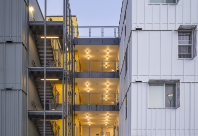 Exterior view of the entry to 88 Park Street at Midway Village at dusk.