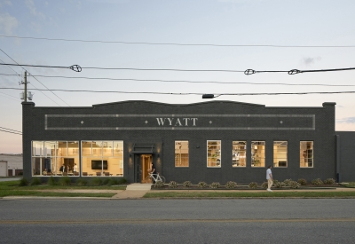 Exterior street view of Wyatt Builds at dusk.