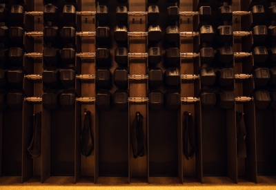 Interior view of the custom weight racks in the strength classroom at Supertone.