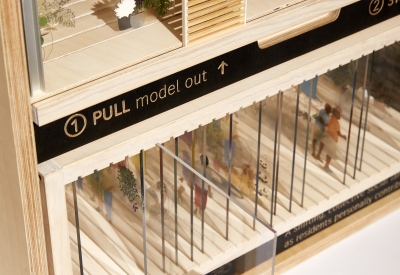 Product photography of architectural model, detail showing interaction