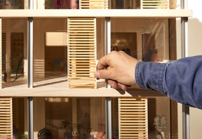 Product photography of architectural model, detail showing interaction